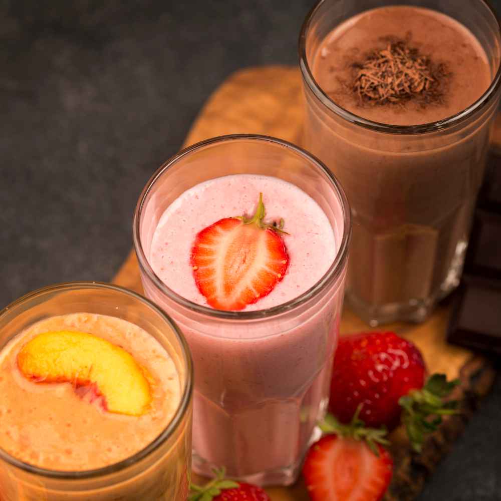 high-angle-selection-milkshake-glasses-with-chocolate-fruit